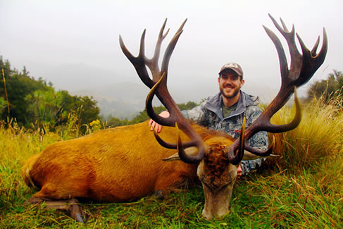Tyler Shanks with a SCI gold medal wild red stag